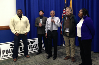 Lawrence Hamm, chairperson of the People's Organization for Progress (center), holds a press conference at Newark, N.J. City Hall on Dec. 15, 2016, reacting to news that the city's Fraternal Order of Police and Superior Officers Association had gained a state Superior Court injunction against the city's police Civilian Complaint Review Board. Also at the press conference are, from left, CCRB Chair Rick Robinson, Newark Anti-Violence Coalition representative Zayid Muhammad, radical journalist-activist Dave Hungerford and Newark NAACP leader Deborah Smith-Gregory. Todd Steven Burroughs